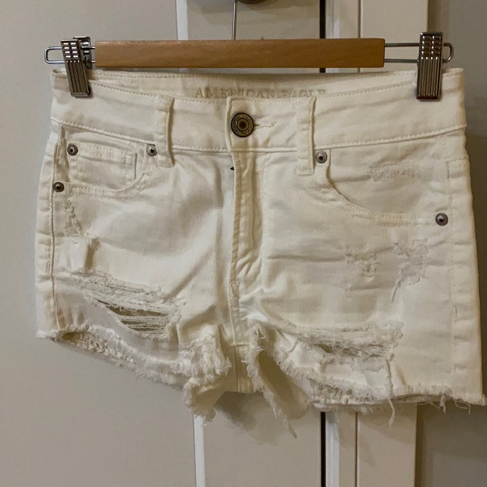 White distressed shorts